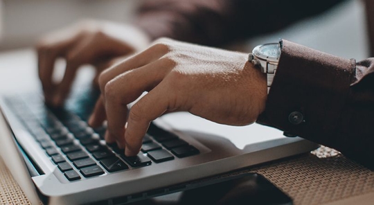 man searching for a divorce attorney online